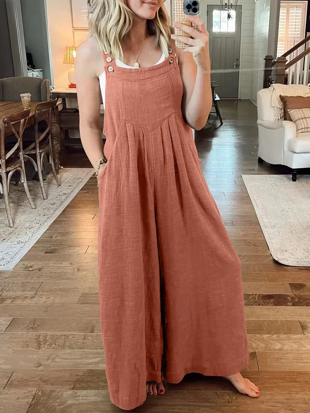 đ Ărmlös jumpsuit med vida ben och fickor för damer