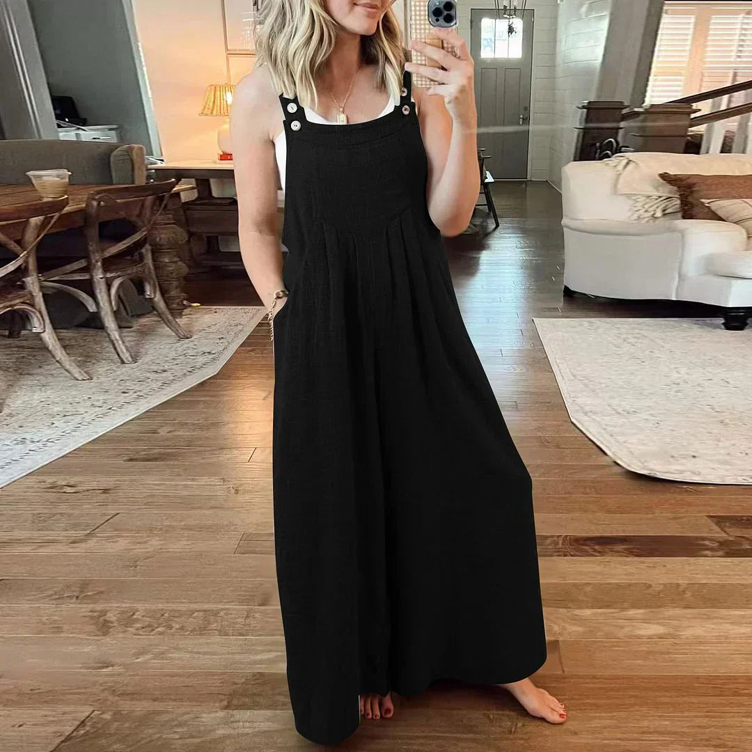 đ Ărmlös jumpsuit med vida ben och fickor för damer