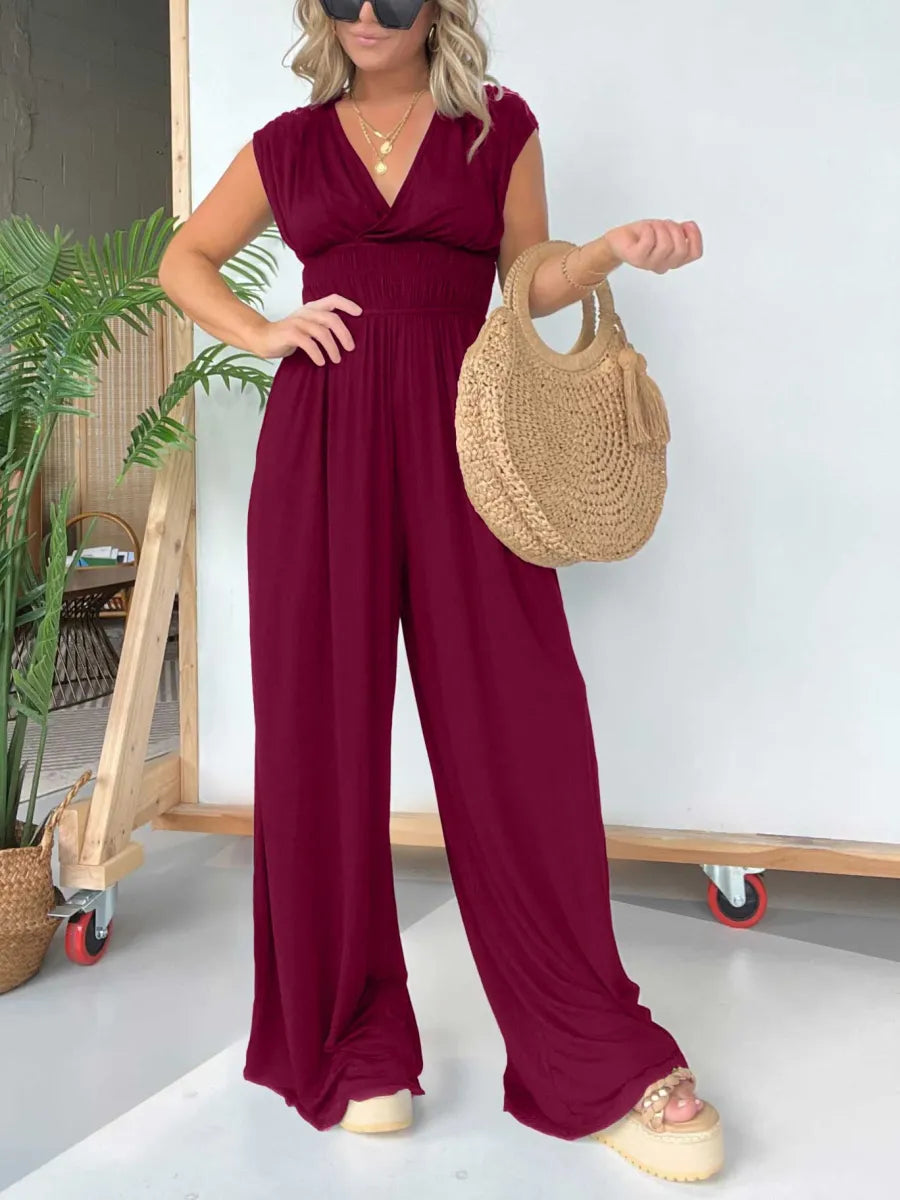 đ„Jumpsuit med V-ringning och vida ben och justerbart knytband i ryggen