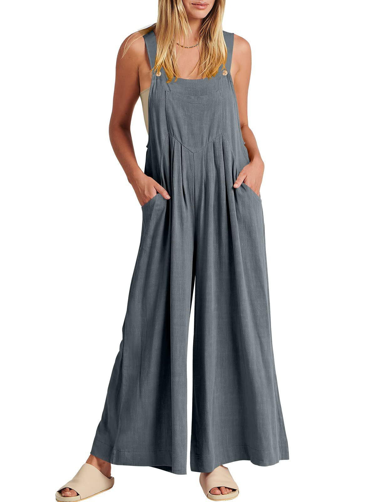 đ Ărmlös jumpsuit med vida ben och fickor för damer