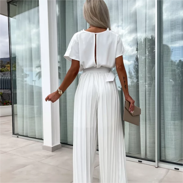 Enfärgad jumpsuit med hög midja och veckade ben