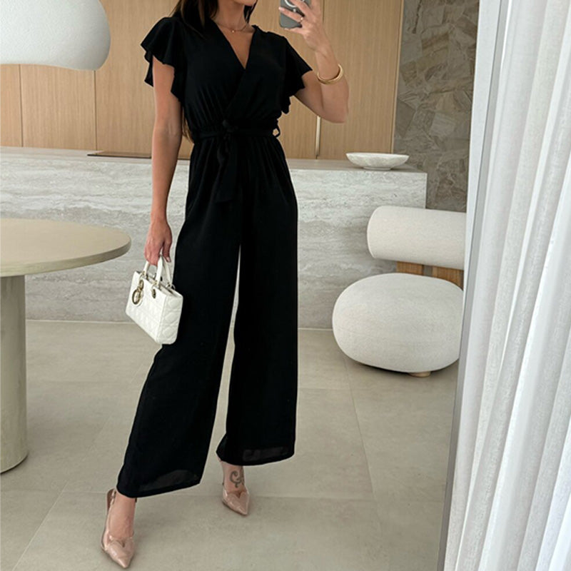 Enfärgad jumpsuit för kvinnor med V-ringning, volangärmar och vida ben