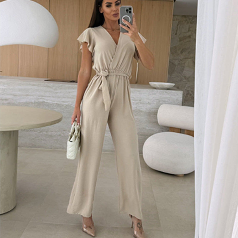 Enfärgad jumpsuit för kvinnor med V-ringning, volangärmar och vida ben