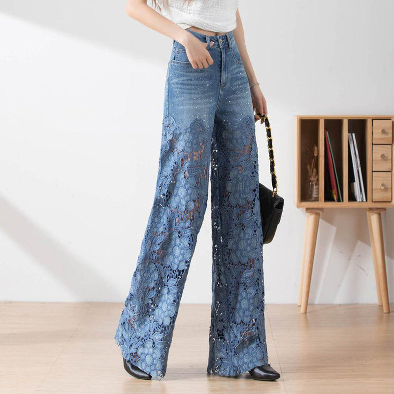 Dambyxor med hög midja i blå denim och vida ben med utskurna spetspaneler
