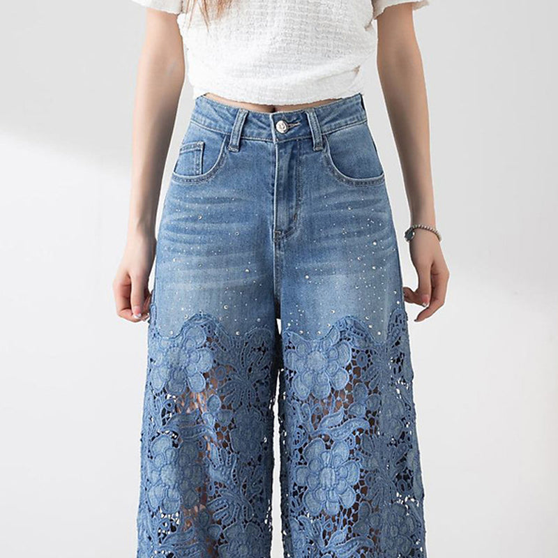 Dambyxor med hög midja i blå denim och vida ben med utskurna spetspaneler