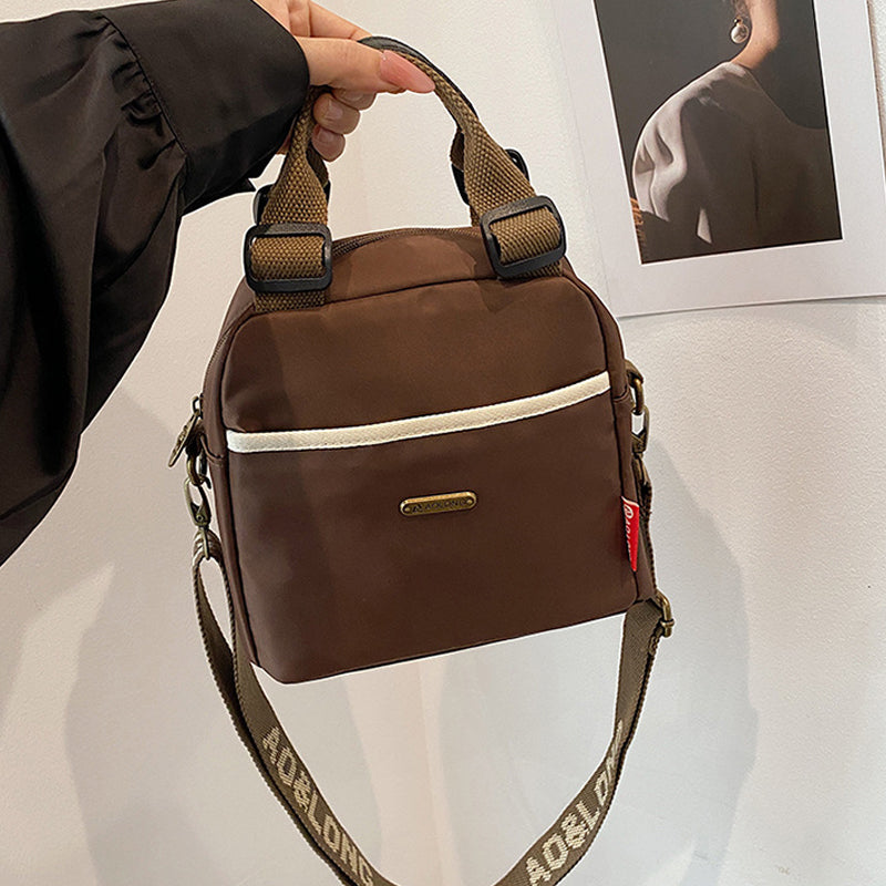Mångsidig crossbody-väska med stor kapacitet