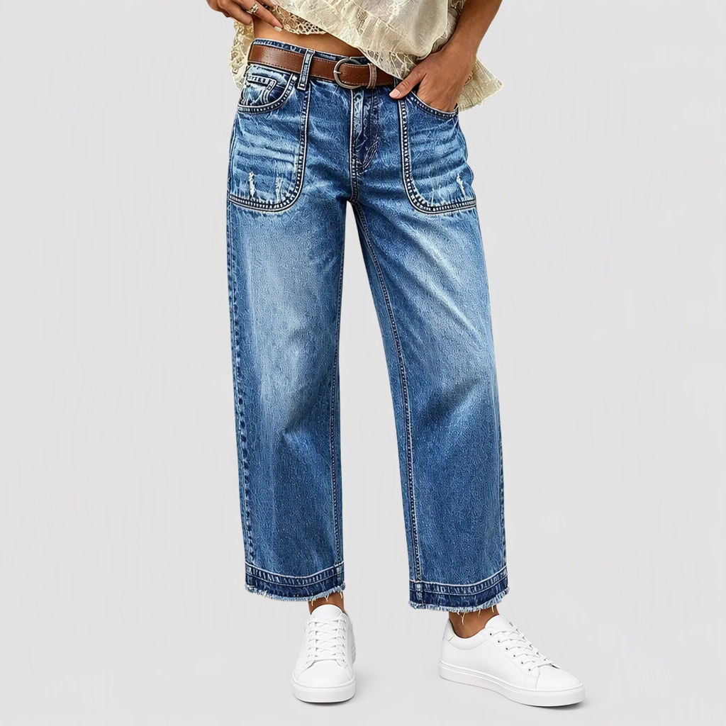 Vintage-jeans för damer i stretchtyg med raka ben, slitna påsydda fickor och fransiga, obearbetade benslut
