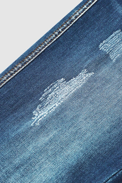 Slitna capris-jeans med upprullad fåll