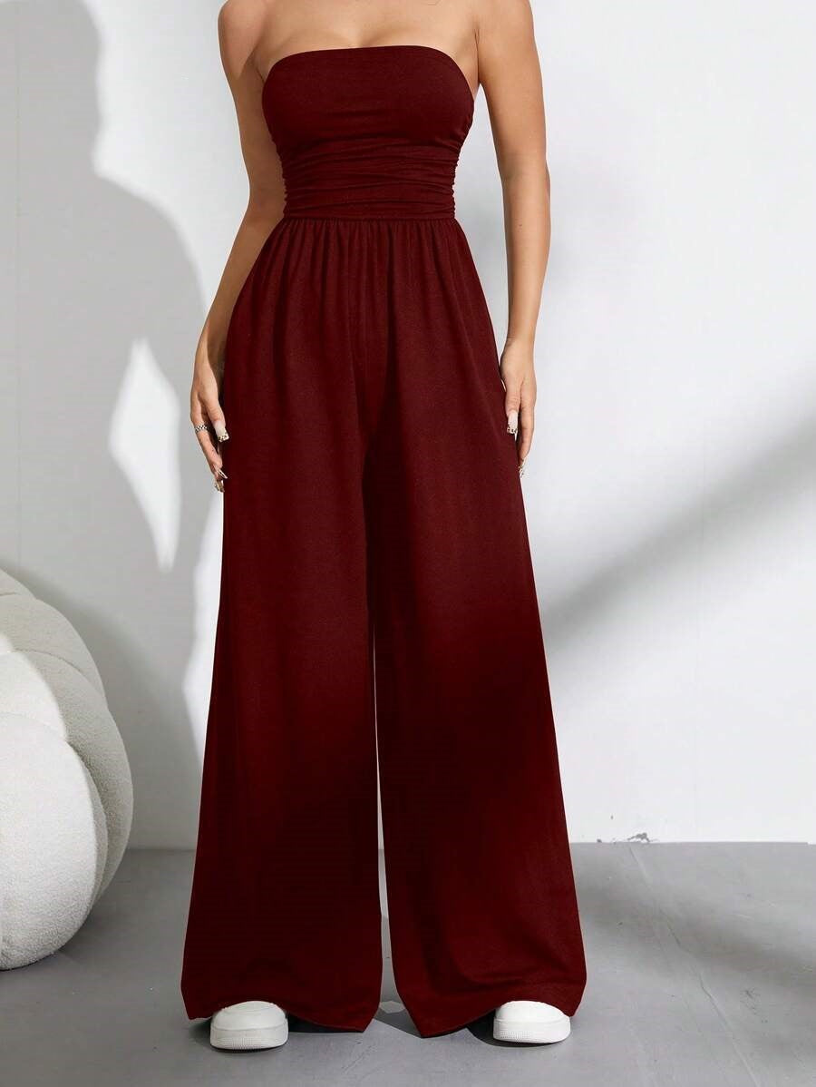 👗🌸 Elegant axelfri jumpsuit med vida ben