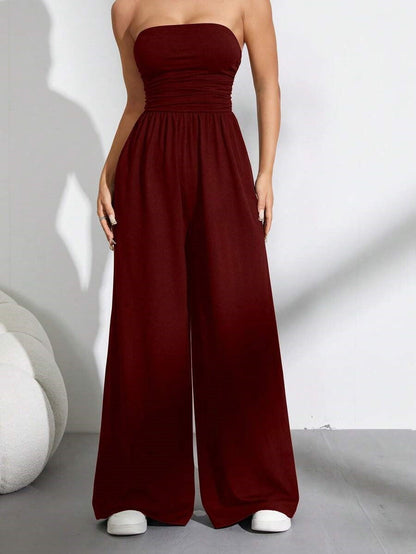 👗🌸 Elegant axelfri jumpsuit med vida ben