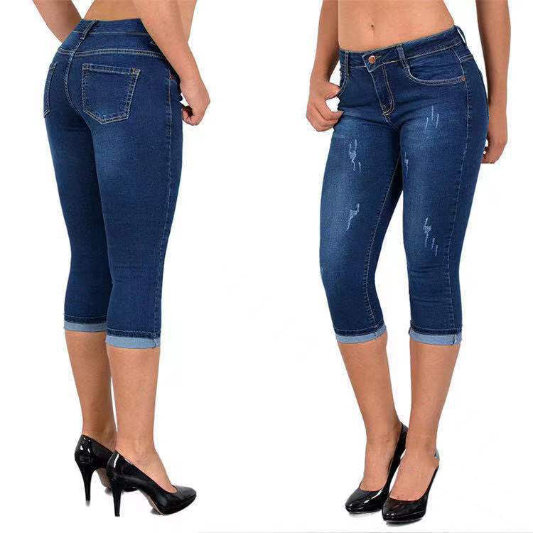 Slitna capris-jeans med upprullad fåll