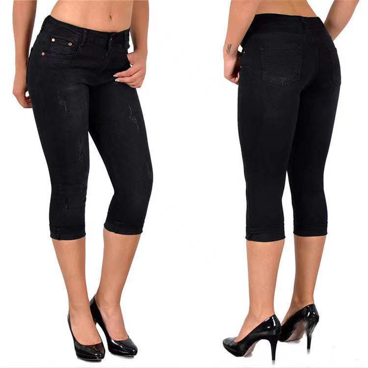 Slitna capris-jeans med upprullad fåll