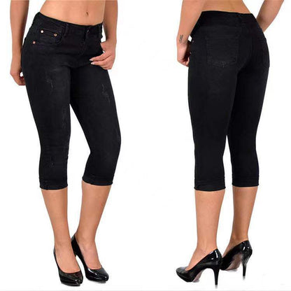 Slitna capris-jeans med upprullad fåll