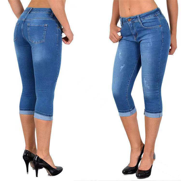 Slitna capris-jeans med upprullad fåll
