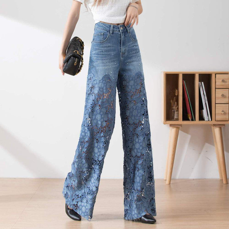 Dambyxor med hög midja i blå denim och vida ben med utskurna spetspaneler