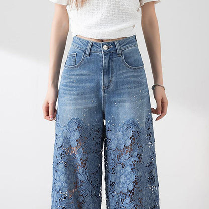 Dambyxor med hög midja i blå denim och vida ben med utskurna spetspaneler