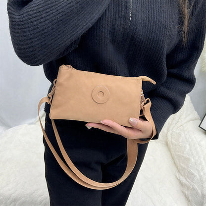 Modig zip-crossbody-väska