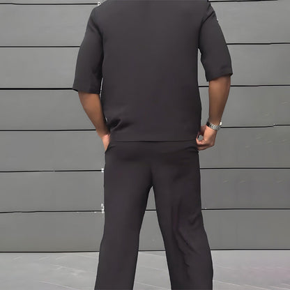 Modernt minimalistiskt set med kortärmad blazer och byxor