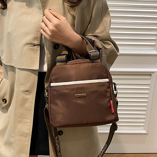 Mångsidig crossbody-väska med stor kapacitet
