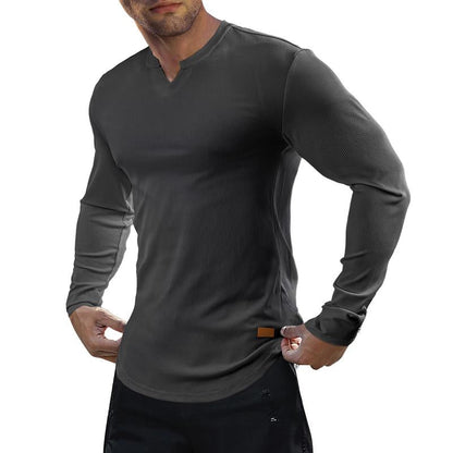 V-ringad långärmad T-shirt i ribbat tyg för träning, fitness och sport