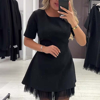 Kvinnors glittrande miniklänning med spetsar och korta ärmar | Elegant och glittrande
