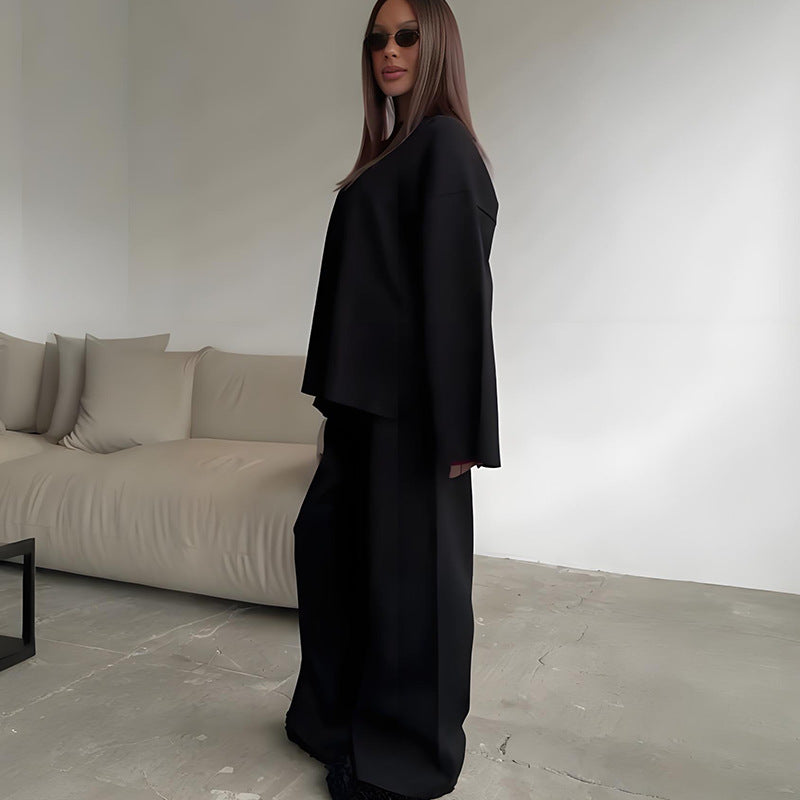 2-delat set med damtröja och byxor med vida ben