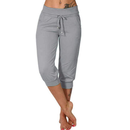 Joggingbyxor med hög midja och smal passform, dragsko och fickor