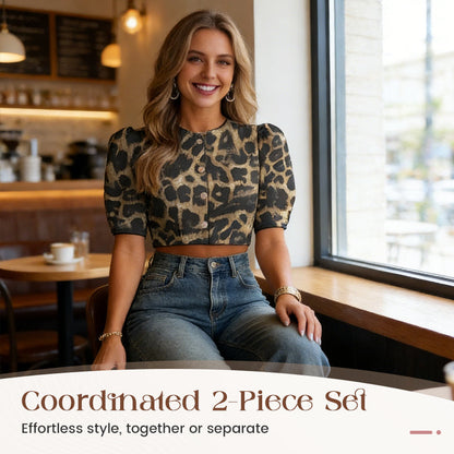 Set med elegant kort topp med puffärmar och byxor med vida ben
