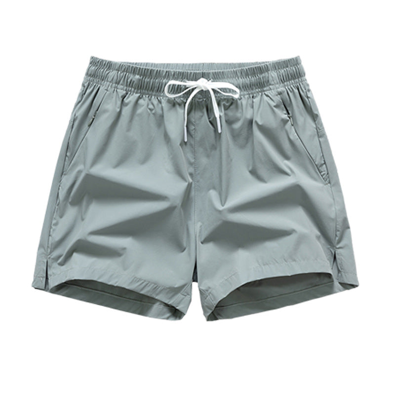 Snabbtorkande sportshorts för män med fickor