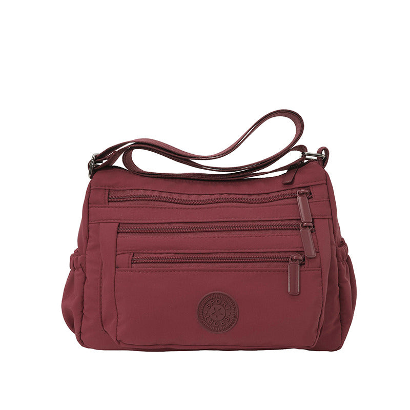 Lätt crossbody-väska i nylon med flera fickor