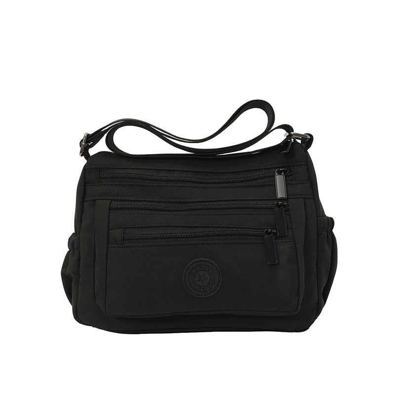 Lätt crossbody-väska i nylon med flera fickor
