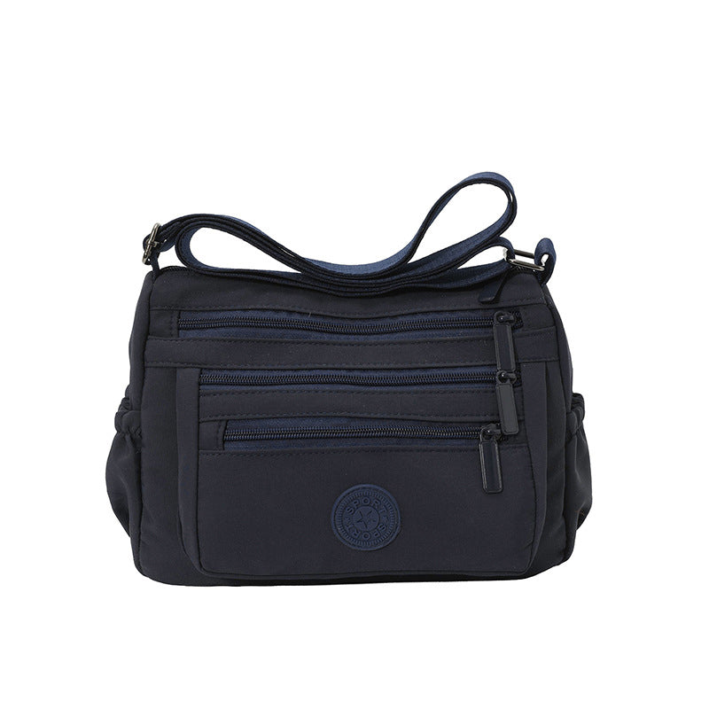 Lätt crossbody-väska i nylon med flera fickor