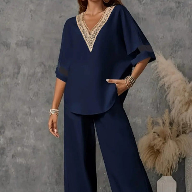 Set med elegant topp med V-ringning och byxor med vida ben