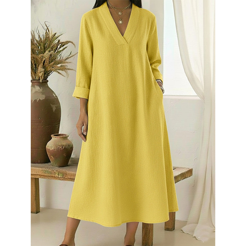 👗🌿 V-ringad A-linjeklänning i linne med fickor