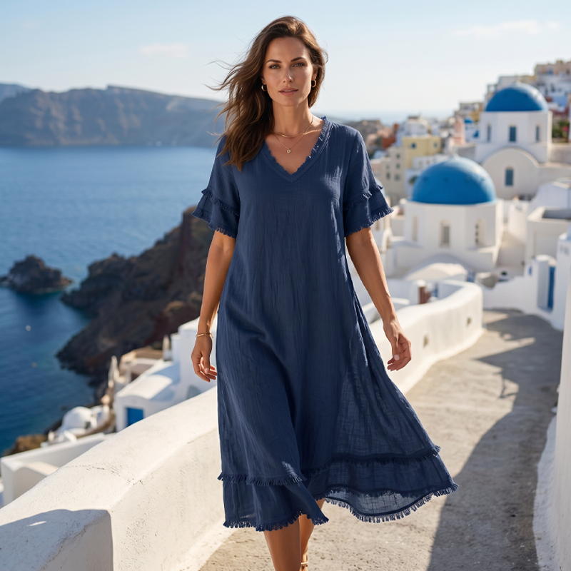 👗🌸 Ledig midi-klänning med V-ringning och bohemiska tofsar