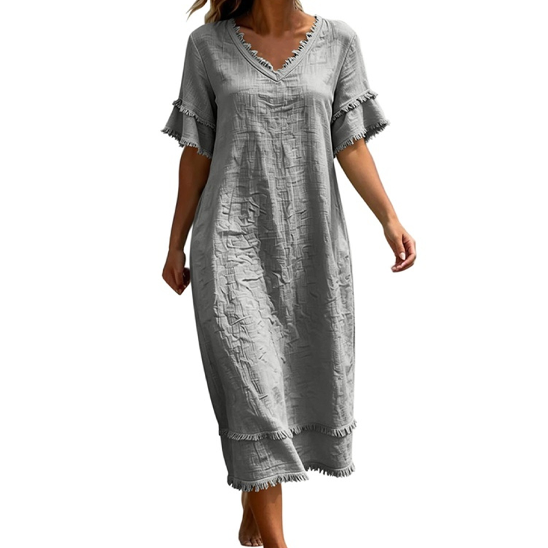👗🌸 Ledig midi-klänning med V-ringning och bohemiska tofsar