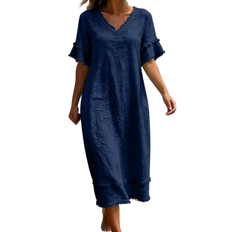 👗🌸 Ledig midi-klänning med V-ringning och bohemiska tofsar