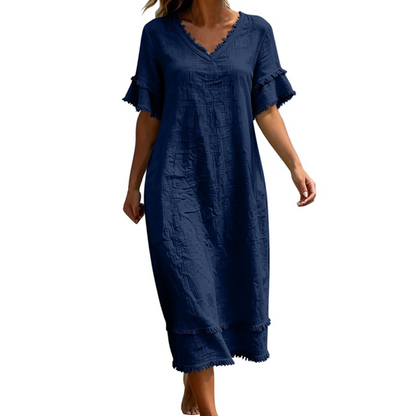 👗🌸 Ledig midi-klänning med V-ringning och bohemiska tofsar