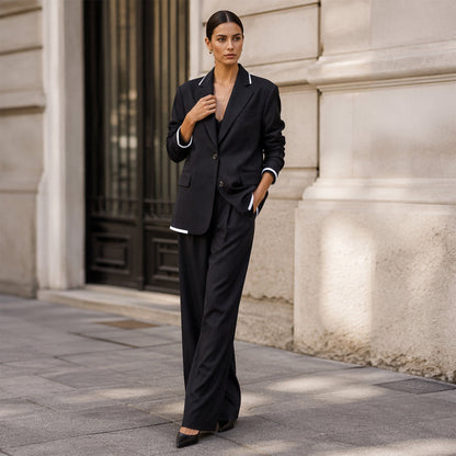 Set med elegant damblazer och byxor med vida ben