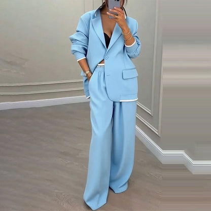 Set med elegant damblazer och byxor med vida ben