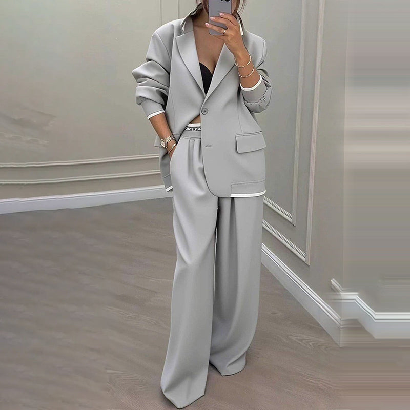 Set med elegant damblazer och byxor med vida ben