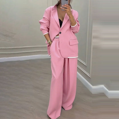 Set med elegant damblazer och byxor med vida ben
