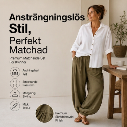Damset med lös skjorta och draperade byxor