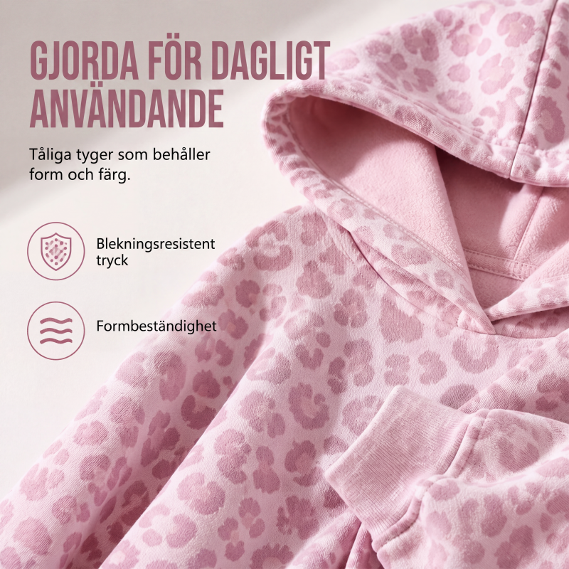 Damleopardmönstrad huvtröja
