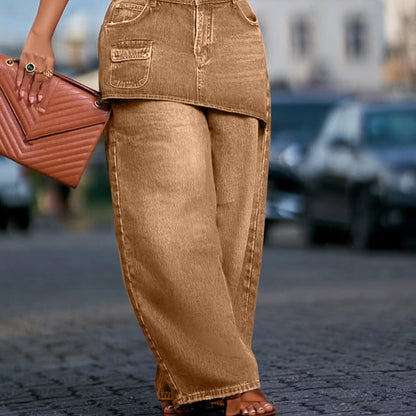 Kjol lager ovanpå denimjeans för kvinnor