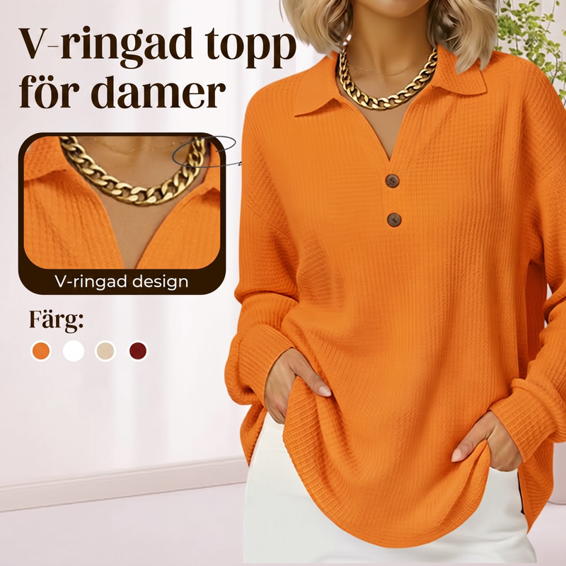 Damtopp med V-ringning i våffelstickad och långa ärmar