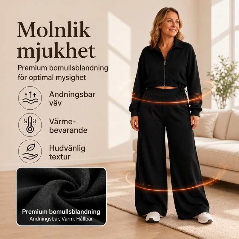 Damset med kort dragkedja-tröja och vida byxor