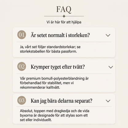 Damset med kort dragkedja-tröja och vida byxor