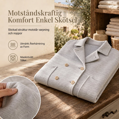 Klassiskt enfärgat ytterplagg